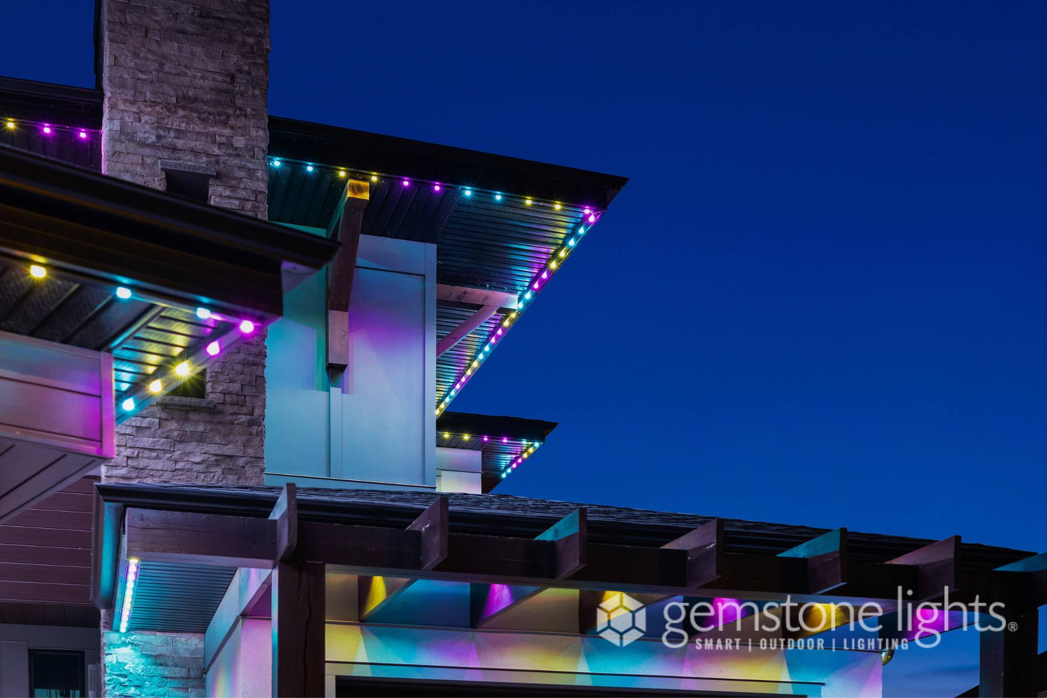 Permanent Gemstone LED soffit lighting installed on Tuscany NW Calgary home by Calgary Permanent Lights