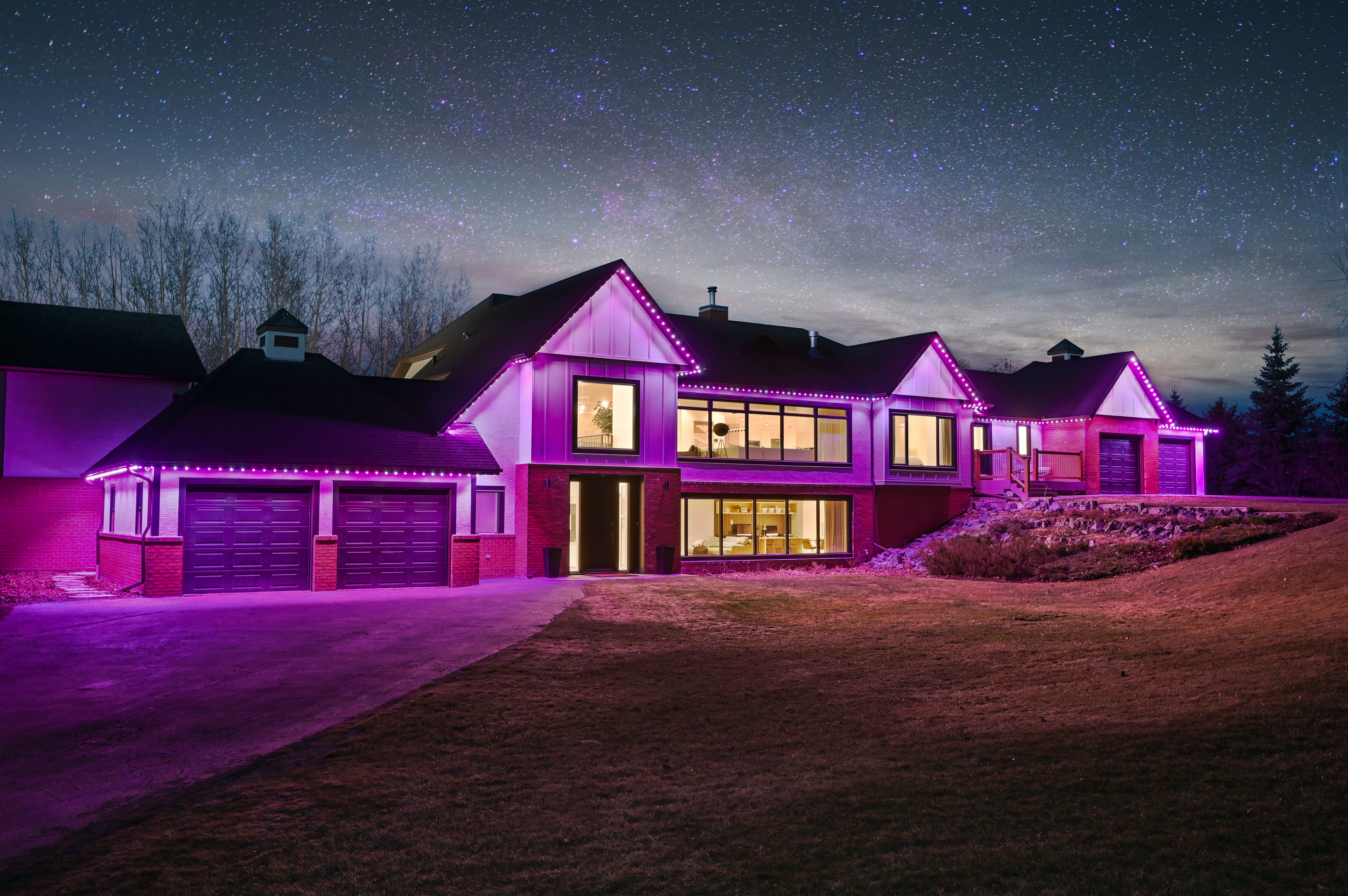 Calgary home with purple and pink Halloween Gemstone Lights permanent LED display