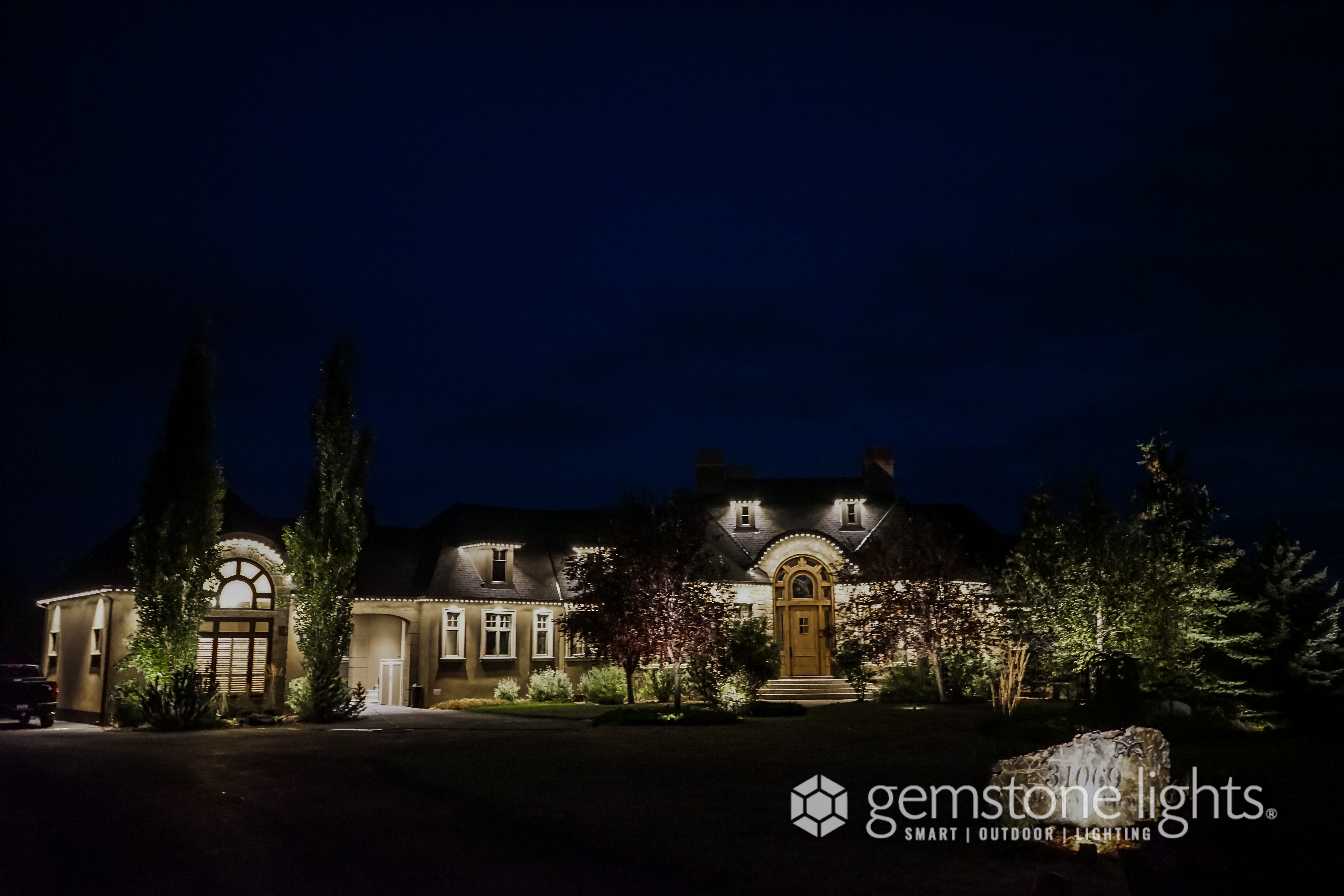 Calgary property with full perimeter security flood lighting using Gemstone Lights — Calgary Permanent Lights, authorized Gemstone Lights installer Calgary