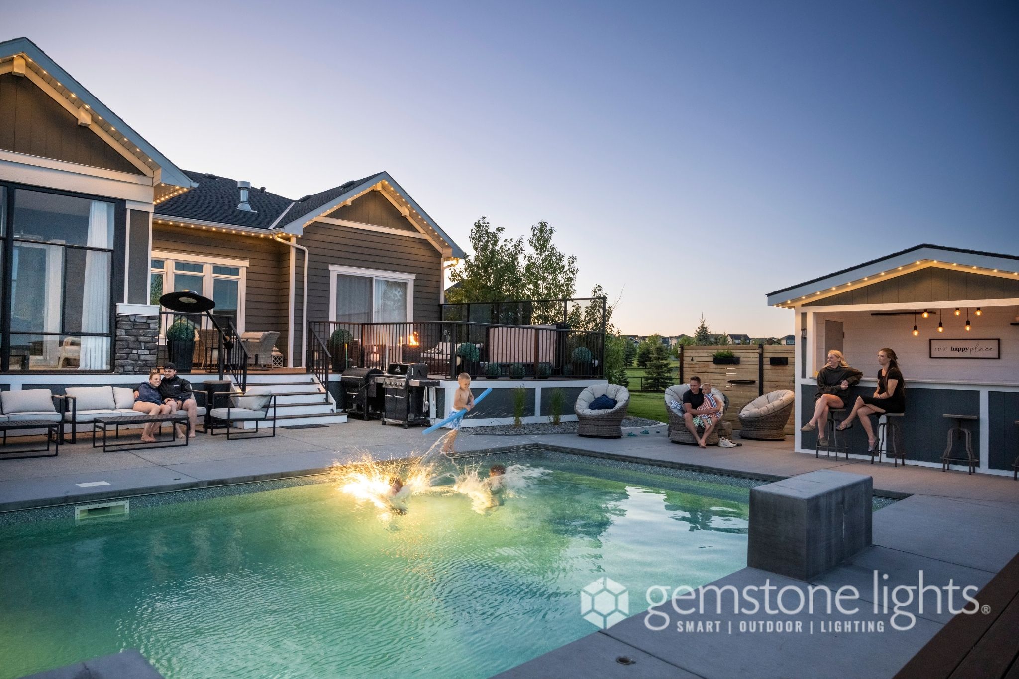Calgary backyard pool area with ambient Gemstone Lights LED lighting — Calgary Permanent Lights, authorized Gemstone Lights installer Calgary