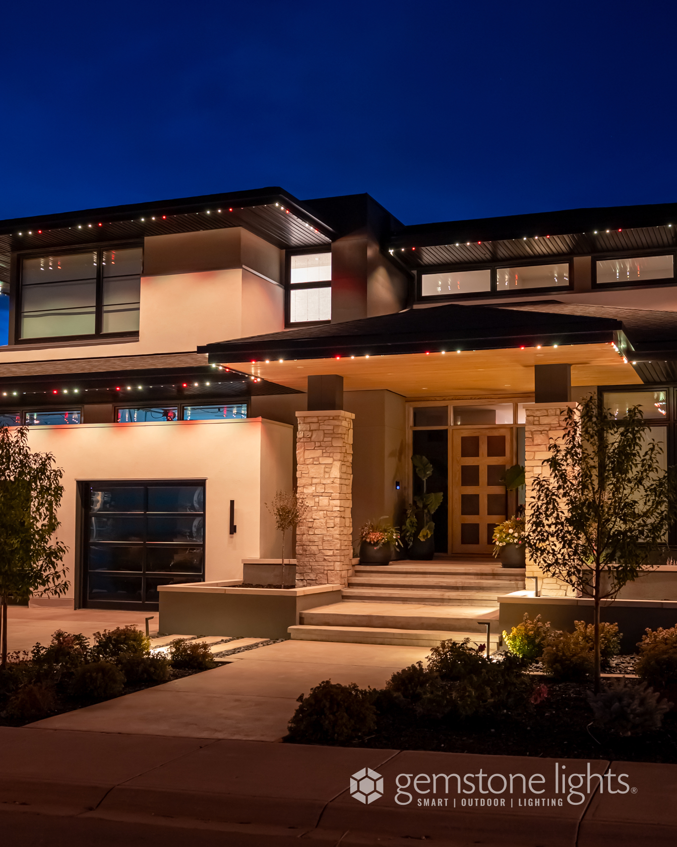 Auburn Bay SE Calgary home with Gemstone Lights permanent LED roofline by Calgary Permanent Lights